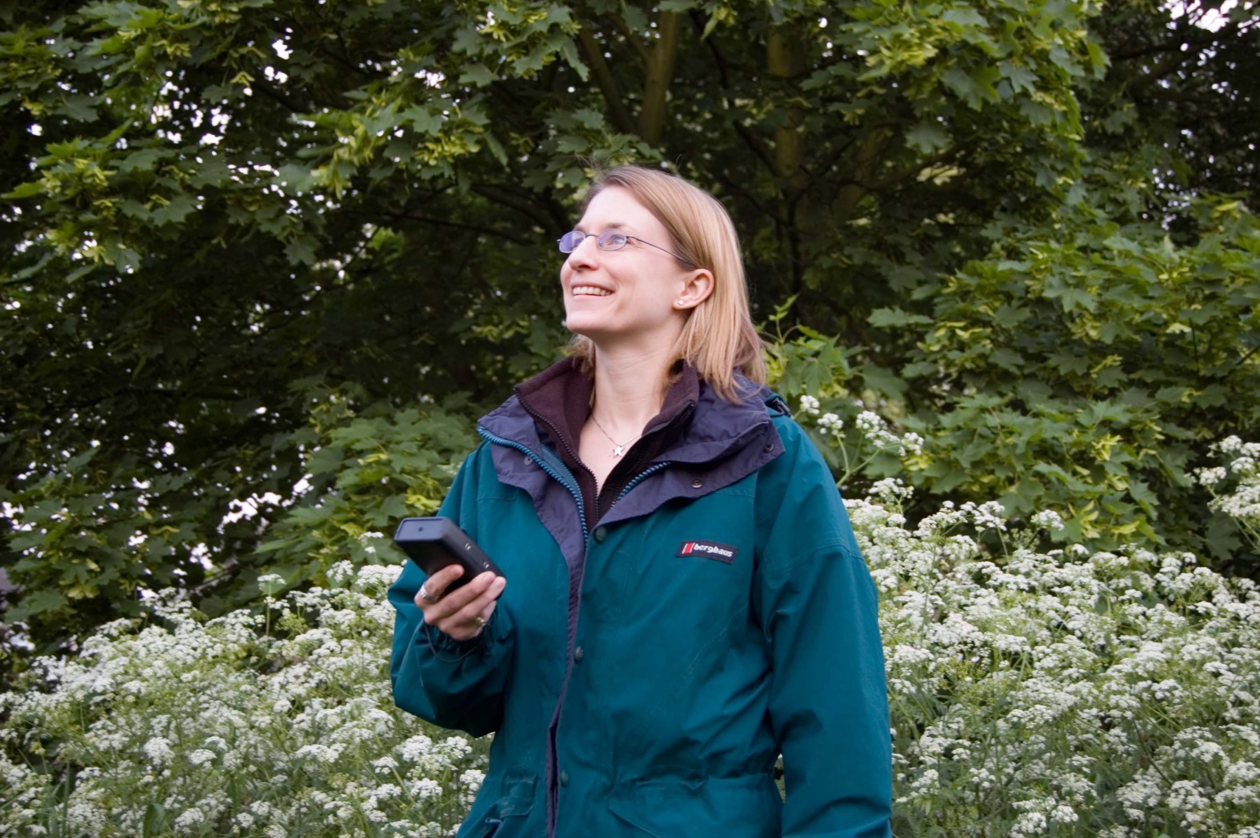 Training Batwatcher Image of a woman in outdoor clothing holding a bat detector