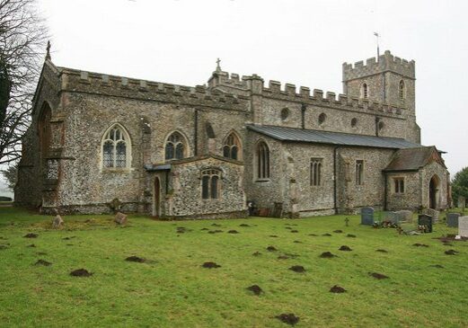 Chrishall Holy Trinity John Salmon A long grey church with a low tower, taken from the graveyard
