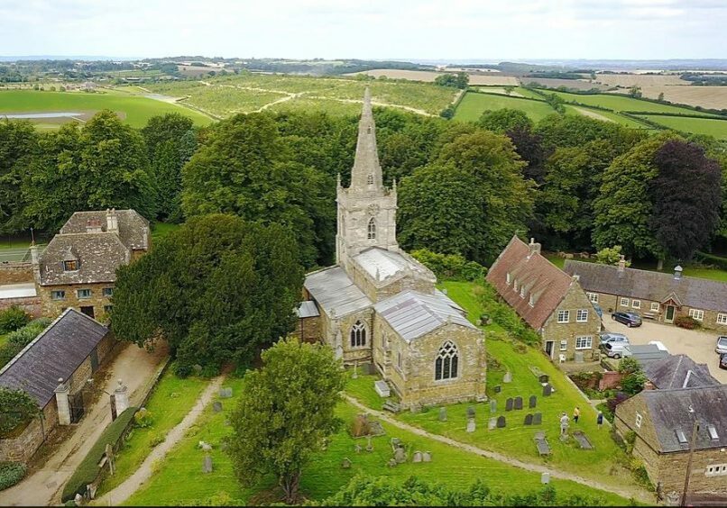 St John, Cold Overton, Leics. aerial view Aerial view of church with steeple, with churchyard, houses and far views