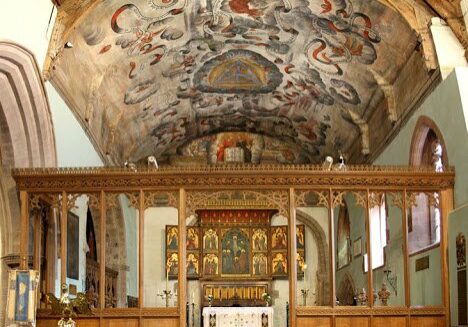 St Mary, Bromfield painted chancel ceiling Painted ceiling of church chancel with rood screen and triptych behind altar