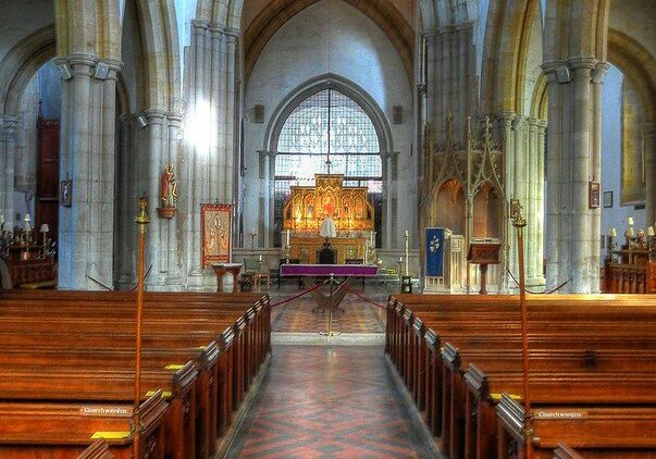 church interior showing tiled floor and arches