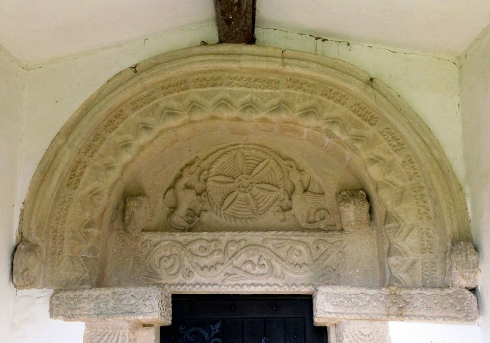 St Edmund's, Egleton Norman tympanum south door Alan Murray-Rust Carved stone above church door depicting mythical beasts and foliage