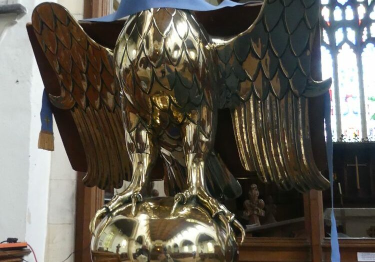 ChurchImages-Norfolk Redenhall St Mary Lectern 1 A brass lectern showing an eagle with two heads standing on a globe